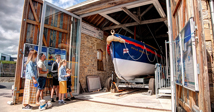 Family looking at lifeboat at East Durham Heritage and Lifeboat Centre, County Durham.